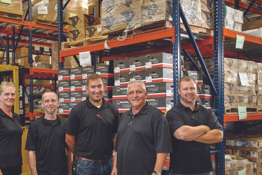 Rush Truck Leasing employees standing in parts warehouse