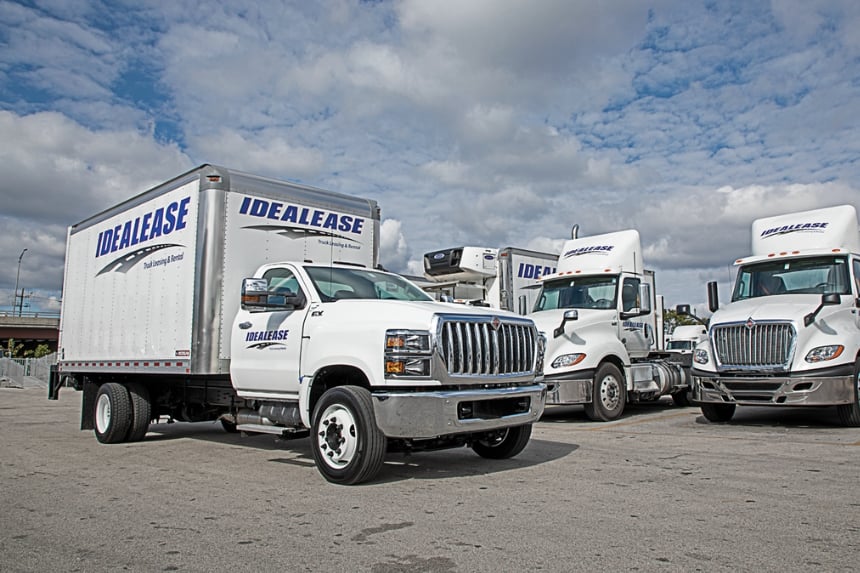 Group of Idealease rental trucks